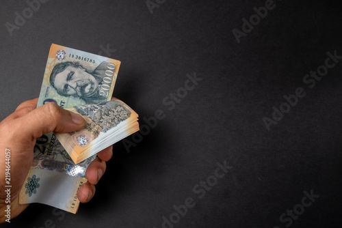 Fotografie Hungarian 20000 forint banknotes held in hand