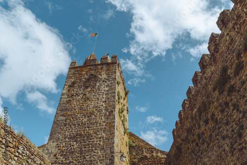Obraz na płótnie The historic stone keep of Montemor-o-Novo Castle under a blue sky, Portugal