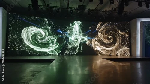 Modern stage with large LED screen displaying abstract light trails