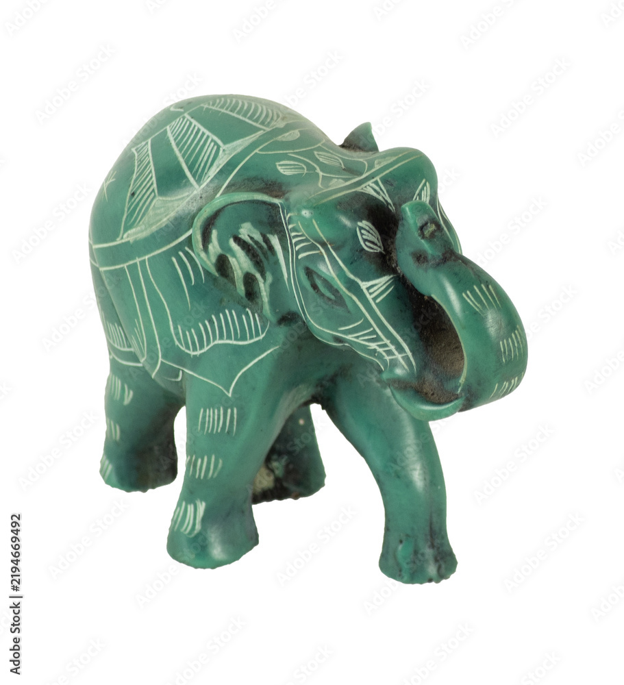 Obraz premium Green carved elephant figurine bringing luck and prosperity