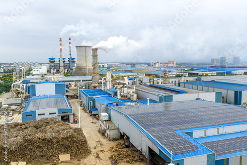 Fotografie Solar panels installed on the roof of industrial factory buildings