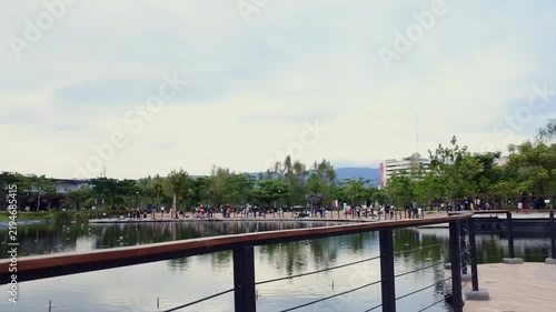 Static view of public park and lake with mountain nature scenery