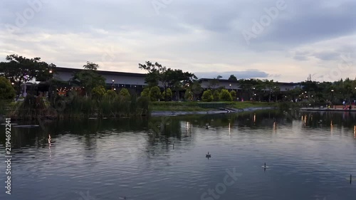 Static view of peaceful lake and public park with natural sky scenery