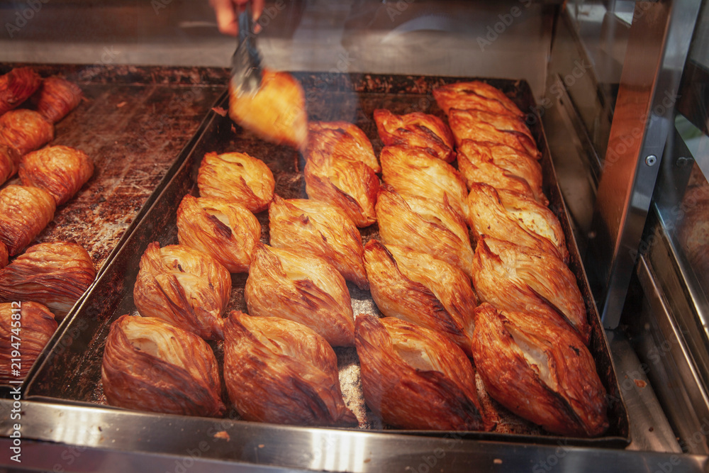 Obraz premium Traditional Maltese pastizzi pastry displayed in a bakery display case on Gozo island.