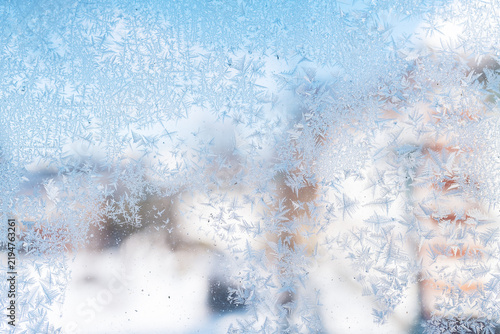 Close up  frost crystals on window glass at sunny day