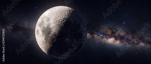 Moon displaying half light and shade floats near the bright Milky Way galaxy in deep space.