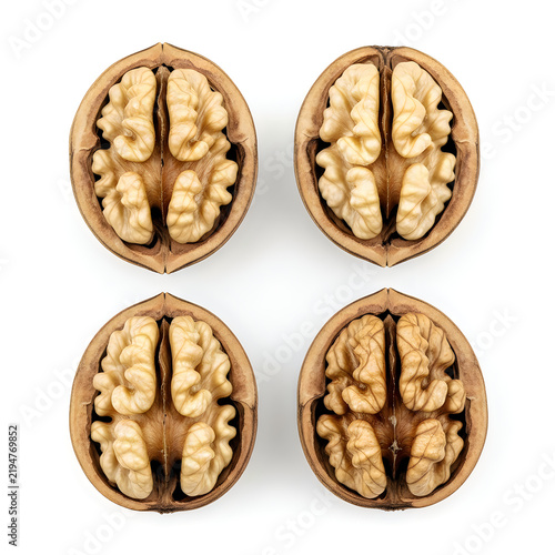 Cross section of walnut halves with kernels isolated on white background