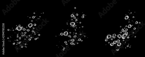 Transparent air bubbles floating in three clusters against a black background, creating a clean aquatic texture for water effects, beverage designs, underwater scenes, overlays, creative compositions.