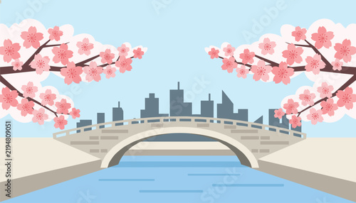 Romantic landscape featuring a traditional stone arch bridge framed by blooming pink cherry blossom trees and city towers.