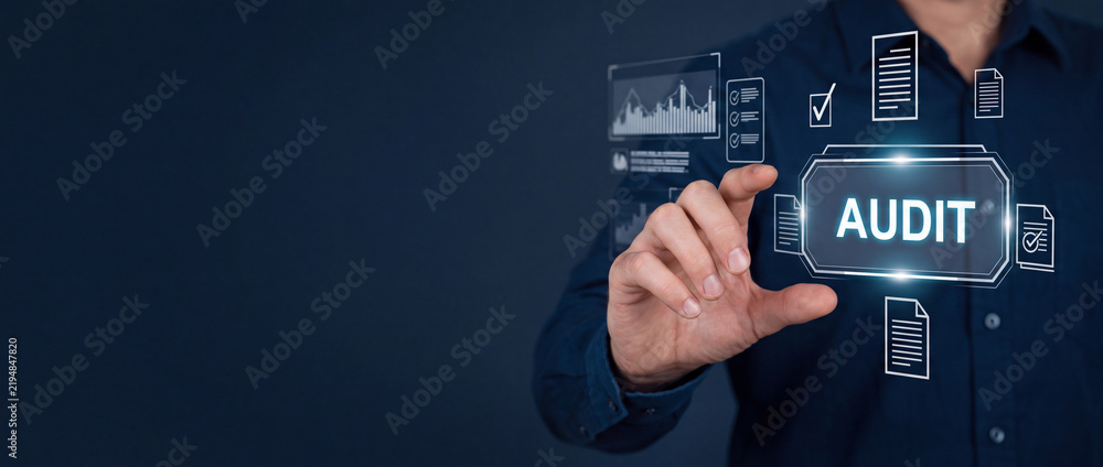 Obraz premium Businessman interacting with a futuristic digital audit interface featuring financial charts and document verification icons on a dark background for corporate compliance and risk assessment.