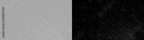 Rain or snow falling overlay texture. White weather effect on transparent and black backgrounds. Winter storm design element