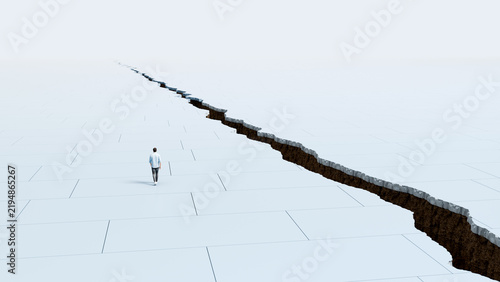 Obraz na płótnie Man facing massive earthquake crack running across ground blocking path to other