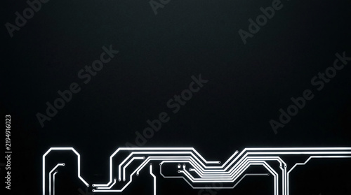 Minimalist white glowing circuit board lines on a dark black background featuring futuristic digital electronic hardware paths and copy space for technology software engineering design.