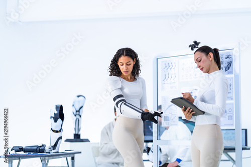 Konstfotografi Machine perception laboratory readout, an engineer studies her tablet screen whi