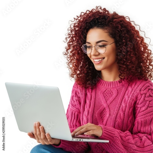 Woman smiling while using a laptop