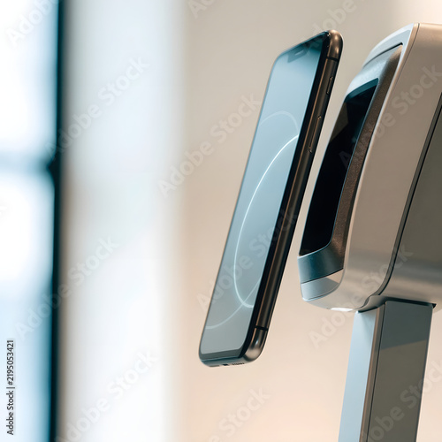 Minimalist contactless mobile payment concept with smartphone and POS card reader terminal