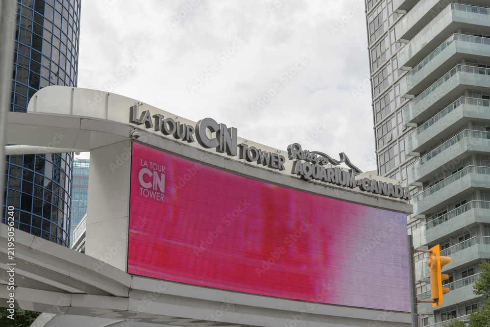 Obraz premium La Tour CN Tower + Ripley's Aquarium of Canada sign facing Front St W (near Isabella Valancy Crawford Park), Toronto