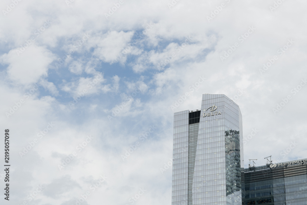 Obraz premium cloudy clearing in the sky and view of Delta hotel / Southcore Financial District buildings, Toronto