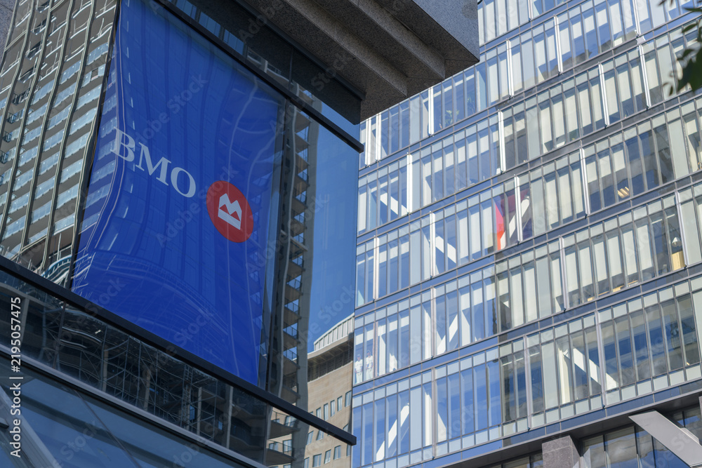 Obraz premium sign of BMO Bank of Montreal at 438 University Av and south elevation detail of 488 University Av business and residential tower, Toronto