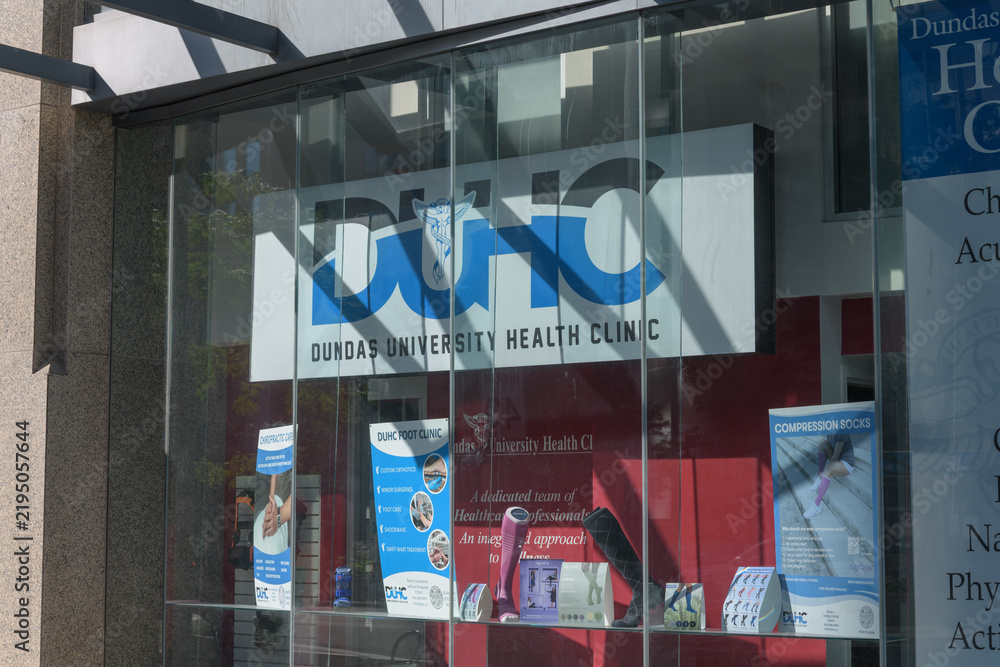Obraz premium signage inside window at Dundas University Health Clinic, a chiropractor, located at 438 University Av, Toronto
