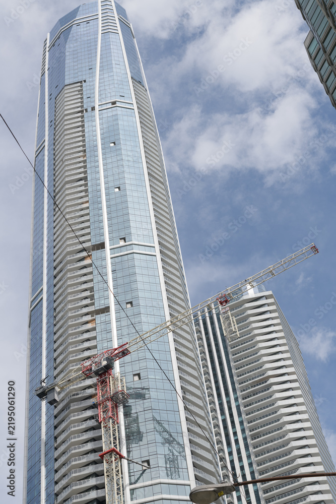 Fototapeta premium SkyTower at Pinnacle One Yonge, designed by Hariri Pontarini Architects, with contemporary faceted glazed facades, as a primarily residential tower, Toronto
