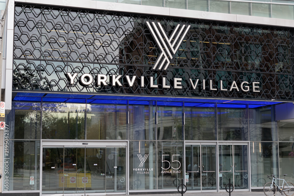 Fototapeta premium exterior building facade and sign of Yorkville Village, an upscale shopping centre in Toronto’s Bloor–Yorkville neighbourhood, located at 55 Avenue Rd