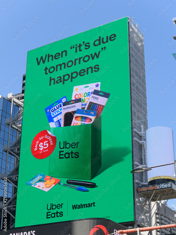 Obraz premium large-format digital spectacular featuring advertisement of Uber Eats and Wal-Mart Canada facing Sankofa Square, Toronto