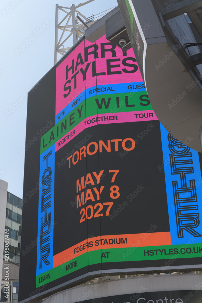 Obraz premium large-format digital spectacular featuring concert promotion for Harry Styles and Lainey Wilson slated for May, 2027 at Rogers Stadium, Sankofa Square, Toronto