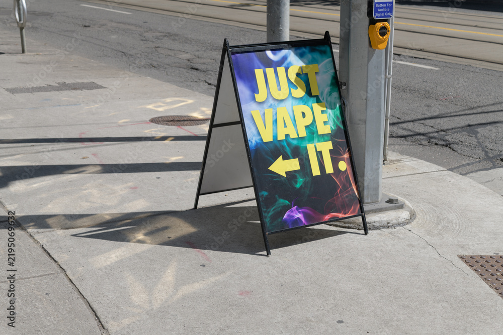 Obraz premium sidewalk a-frame poster sign outside Just Vape It located at 103 Mutual St (seen here on Dundas St E), Toronto
