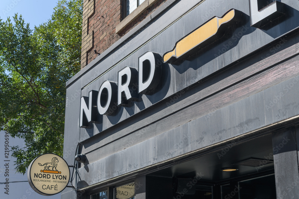 Obraz premium exterior building facade and signage of Nord Lyon Queen St West, a bakery, 665 Queen W Toronto