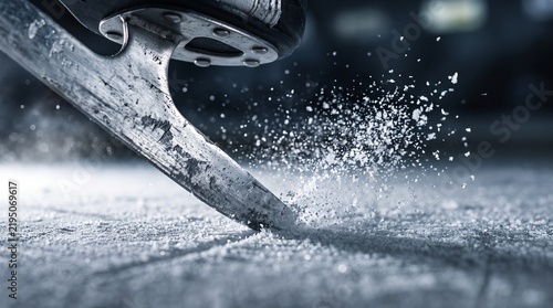 Close-up Ice skate blade cutting ice with spray of snow