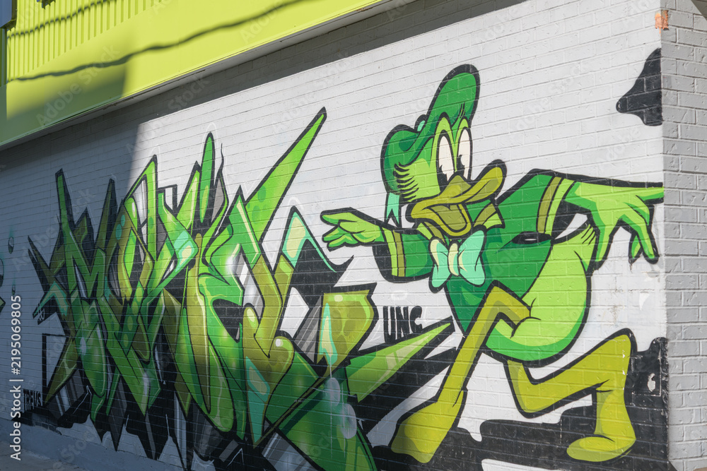 Obraz premium UNC (a Toronto graffiti crew) mural art outside FreshCo, a grocery store, located here at 22 Northcote Av
