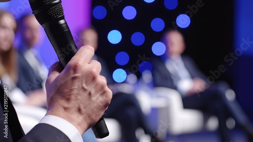 Corporate speaker presenting at panel for conference promotion