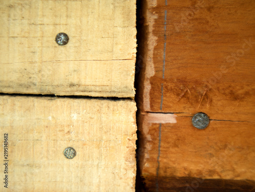 фотографія wooden wall texture in a wooden house building that uses nails to strengthen the