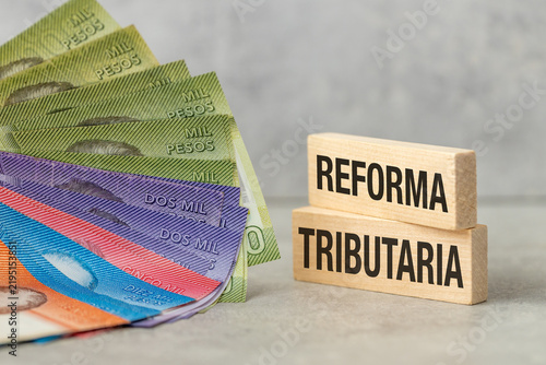 Foto Concept of Chile tax reform with text Reforma Tributaria on wooden blocks and Ch