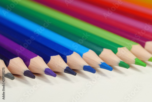 Konstfotografi New wooden colored pencils of rainbow colors, perfectly sharpened, lie on table