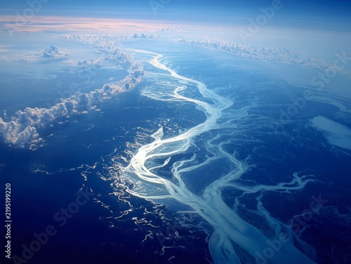 Serene Aerial View of River Meandering Through Blue Ocean Waters