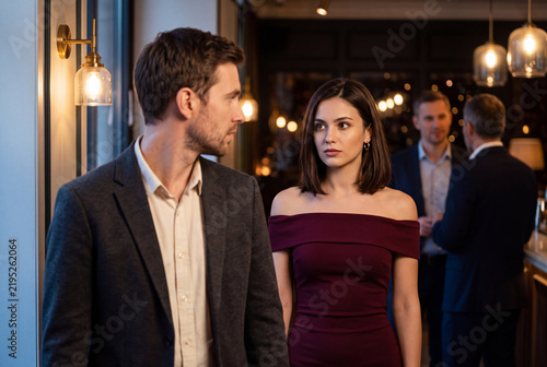 Woman Assessing a New Connection During an Evening Networking Event