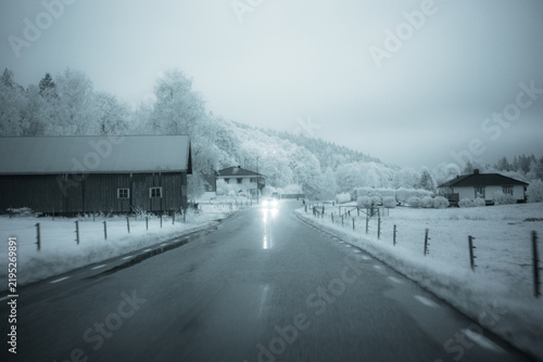Cuadro en lienzo Nature scene captured with infrared filter showing snowy landscape and houses al
