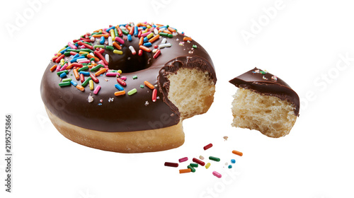 Fotografie Isolated delicious chocolate frosted donut with colorful sprinkles and a missing