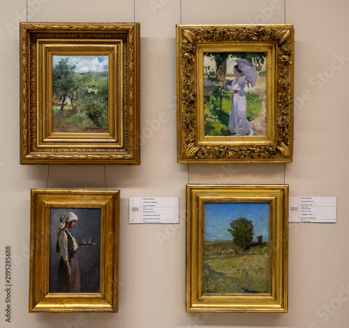 Obraz na płótnie Bucarest, Romania - 6 Nov 25: Four Framed Paintings Displayed on Museum Wall