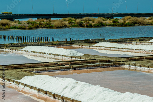 Картината върху платно Salt Evaporation Ponds and Industrial Flats Under a Blue Sky