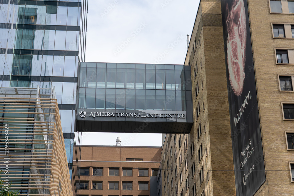 Obraz premiumToronto, Ontario, Canada - September 16, 2026: The signage on the building for Ajmera Transplant Centre located at the Toronto General Hospital in Toronto, Canada. Ajmera Transplant Centre is the la