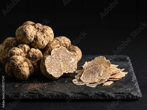 Priceless gourmet white truffle fungi served on black stone