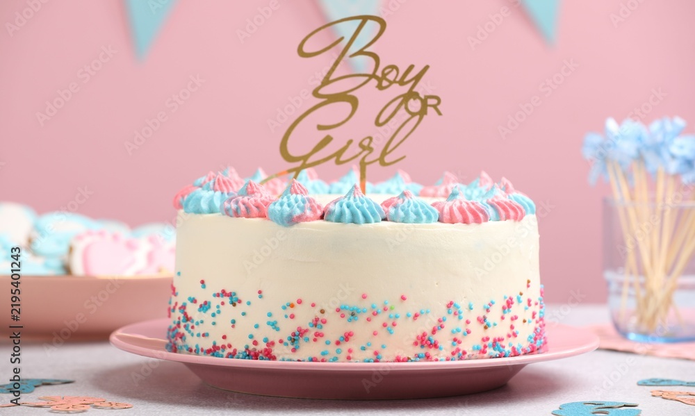 Obraz premium Baby gender reveal party. Tasty cake with decor and cookies on light grey table, closeup