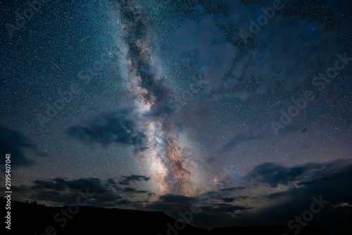 Milky Way Galaxy Rising Over Mountain Silhouette with Clouds