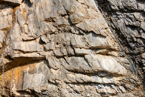 Gaspesie, Quebec, 02 September 2026 : Close-up view of a rugged rock cliff face showing natural geological layers and weathered textures