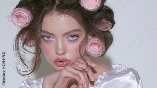 glamorous brunette beauty model with vintage hair rollers
