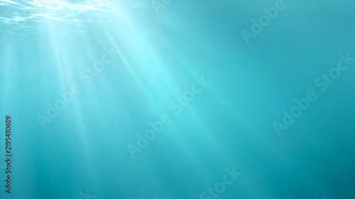 Underwater Blue Ocean Background with Sun Rays, Deep Sea Water, Soft Light Reflections, Waves and Abstract Aquatic Nature Texture for Design