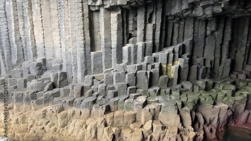 Naturally formed basalt columns in a cave wall with fascinating geological patterns, Fingal's Cave, Staffa, Inner Hebrides, Scotland, Great Britain